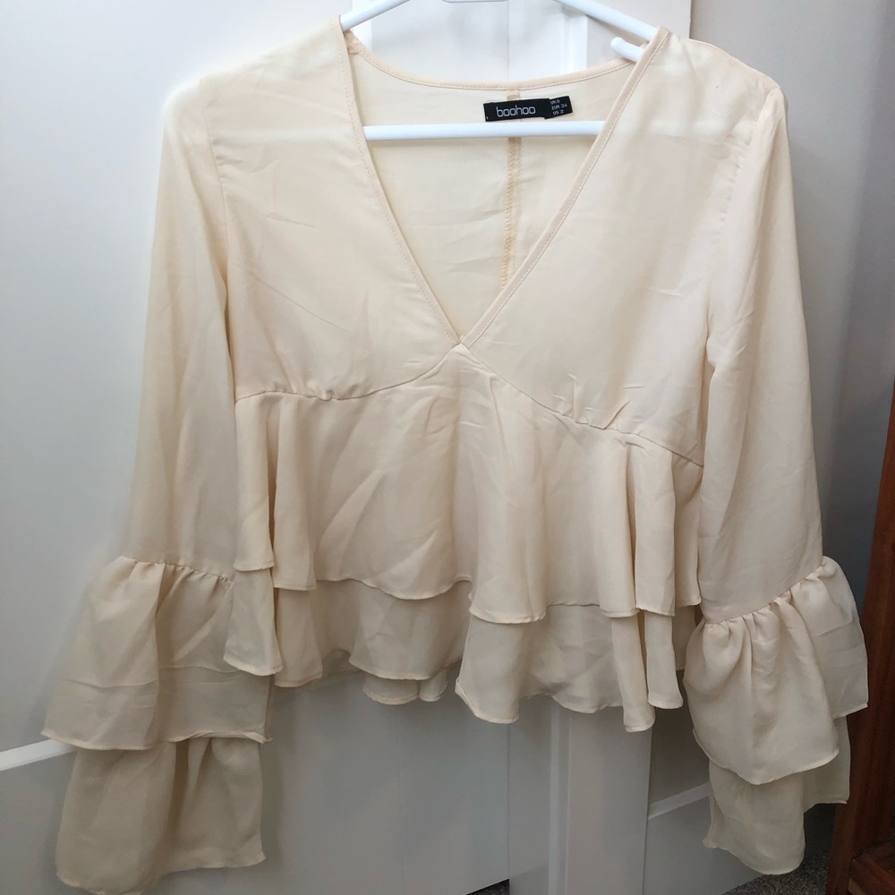 Cream long sleeve blouse with ruffles